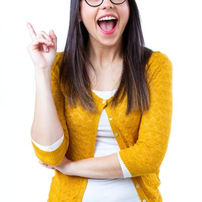 Portrait of pretty young woman with casual wear pointing up